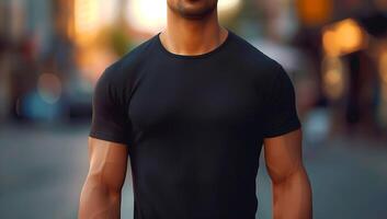 Muscular Man in Black T-Shirt Standing on Blurred Street with Warm Evening Bokeh Lights photo