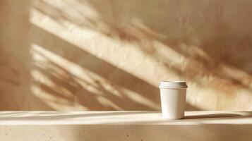 Minimalist White Clear Coffee Cup on Sunlit Table with Textured Beige Background, Perfect for Modern Cafes, Lifestyle Blogs, and Branding Projects photo