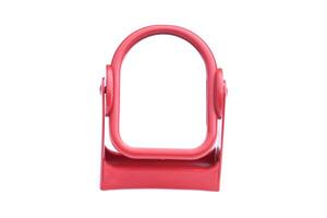 Mirror with stand, red frame isolated on white background. Concept, Beauty accessory. Equipment for looking the reflect when make up. Small table facial mirror. photo