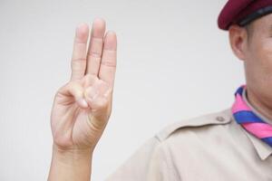 Hand sign code of scout. Concept, Scout activity that teaching in schools Thailand. Hand signs and symbols which meaningful in scouting lesson. Show hand sign for oath. photo