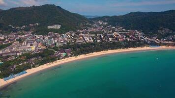 An aerial view of a beach with mountains in the background. View of Kata Beach, Phuket Island, Kingdom of Thailand video