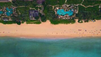 An aerial view of a beach with a large pool in the middle of it video