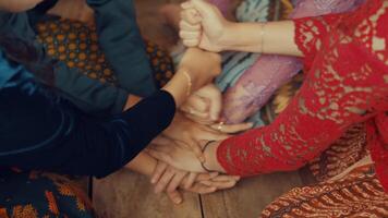 Unity and teamwork with hands stacked together video