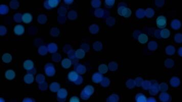 Abstract loop dark blue bokeh particles falling on black background video
