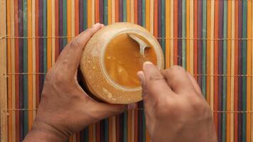 homemade ghee in container on a table , video