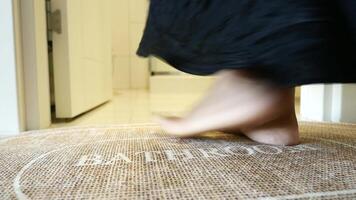 A bathroom mat placed on a clean tiled floor, creating a welcoming and cozy environment in the room video