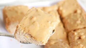 top view of peanut butter and a bread on plate o video