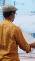 Vertical Professional team touring an office space with real estate agent, evaluating building layout and discussing high class urban property investment. Negotiating a deal with financier expert. Camera B. video