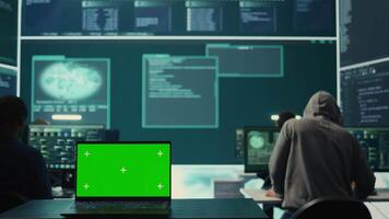 Isolated copy space running on a laptop in high tech agency office, governmental hackers analyzing digital threats on big screens. Working on cybercrime and protection against phishing. Camera B. video