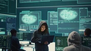 Hackers group failing to hack a system in high tech agency office, reading critical error message on big screen. Specialists trying to steal important database information from rival states. Camera B. video