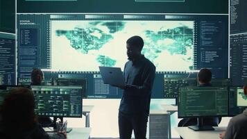 Cyber security team investigates governmental hacking malware attack on internet servers, high tech office. Cybercriminals hack computer systems, threatening account database protection. Camera B. video