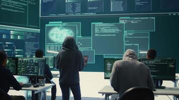 Disappointed team of governmental hackers failing to access database and servers in high tech office, work with big screen to steal passwords for hybrid warfare. Frustrated experts. Camera B. video