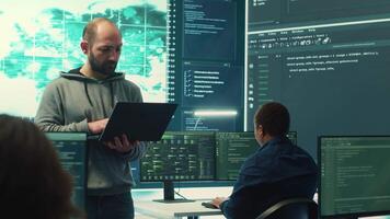 Hackers group using ransomware and phishing tactics to compromise computer networks and gather intelligence for national security and protection during cyberwarfare. Governmental spyware. Camera A. video