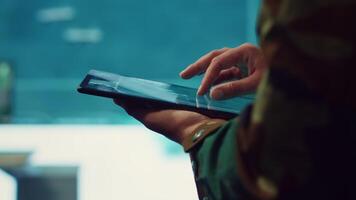 Army officer examines reconnaissance system on a world map, targeting enemy aircraft or warships on the national territory. Military personnel tracks status of deployed units. Close up. Camera A. video