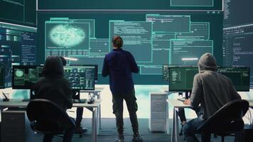 Happy cheerful hackers team gaining access inside network systems, celebrating their achievement and the step forward during hybrid war activities. Pleased experts stealing database info. Camera B. video