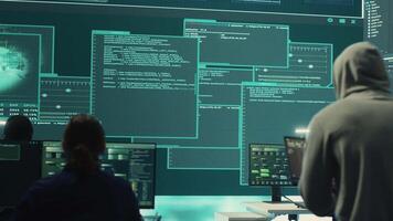 Group of governmental hackers successfully breaking into servers to steal important data, experts feeling happy and proud of their criminal achievement. Espionage system in high tech agency. Camera A. video