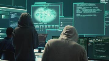 Disappointed team of governmental hackers failing to access database and servers in high tech office, work with big screen to steal passwords for hybrid warfare. Frustrated experts. Camera A. video