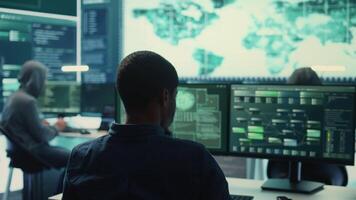 Cyber security team conducting cyber surveillance and threat detection in a governmental agency. Hackers working on cybercrime and malware prevention, data breach protection. Camera B. video