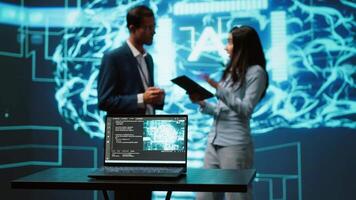 Engineers use AR tech to visualize AI neural networks brain, solving company problems. IT professionals using artificial intelligence augmented reality hologram, camera A video