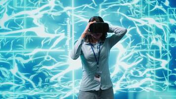 IT expert using VR headset, programming artificial intelligence computing simulating human brain. Technician uses virtual reality technology to build AI machine learning algorithms, camera A video