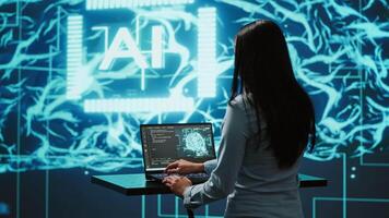 AI specialist reviews data charts, emphasizing importance of data driven decision making in tech industry. Engineer developing innovative artificial intelligence solutions for startup, camera A video