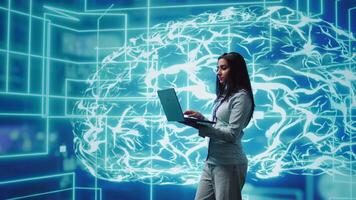 Software developer solving tasks on laptop, running artificial intelligence programming scripts. Woman using notebook to write lines of code for AI applications development, camera B video