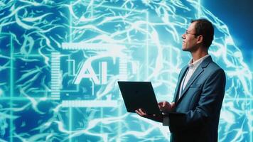 IT expert solving tasks on laptop device, running artificial intelligence programming scripts. Indian man using notebook to write lines of code for AI applications development, camera A video