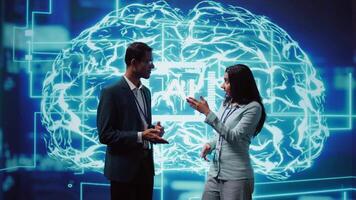 Computer scientists use AI neural networks modeled after human brain to solve complex problems. Startup employees using artificial intelligence to look at data and complete tasks, camera B video