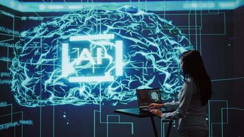 AI specialist reviews data charts, emphasizing importance of data driven decision making in tech industry. Engineer developing innovative artificial intelligence solutions for startup, camera B video