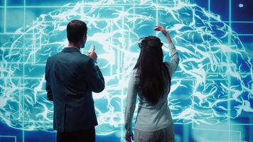 Engineers use VR headset and AI neural networks modeled after human brain to solve complex problems. IT experts using artificial intelligence and virtual reality tech to look at data, camera B video