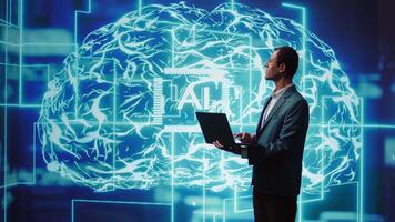 IT expert solving tasks on laptop device, running artificial intelligence programming scripts. Indian man using notebook to write lines of code for AI applications development, camera B video