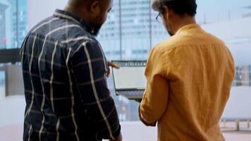 Realtor and business team evaluating workspace design and planning relocation, reviewing blueprints during an office tour. Property investment for startup development. Contract deal. Camera A. video