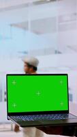 Vertical Real estate experts and business owner review blueprints plan next to isolated mockup, working on new high class office design development. Client sharing her modern workspace vision. Camera A. video