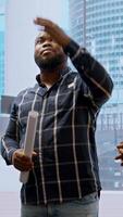 Vertical Broker and client sharing a development vision for the new office space in a high class urban building, realtor working with entrepreneur to negotiate a property leasing contract. Camera A. video
