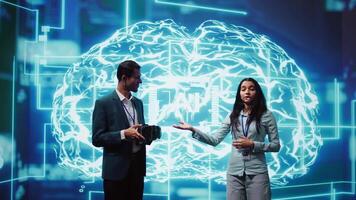 Tech experts presenting VR headset and AI tech during summit presentation, exploring successful implementation of artificial intelligence and virtual reality in driving forward businesses, camera B video