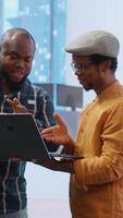 Vertical Entrepreneurs sharing their workspace vision with the broker, evaluating architectural blueprints for a new office space in high class urban building. Potential investment in property. Camera B. video