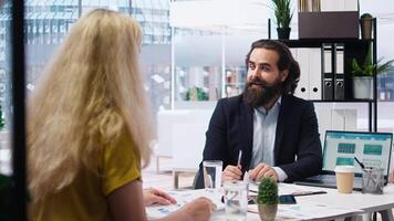 Financial advisor using laptop in office to present clients volatile stock exchange prices going up and down. Family getting consulted on forex trading platforms by brokerage firm expert, camera A video