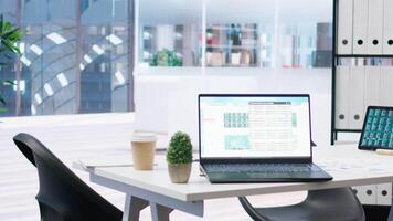 Laptop screen in office showing stock exchange indices changing in real time. Notebook in workspace with forex trading indexes displayed live showing latest price modifications video