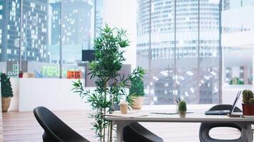 Empty financial department office used for budgeting, forecasting, and financial analysis purposes. Bright modern company workspace with nobody in and devices left open on desks video