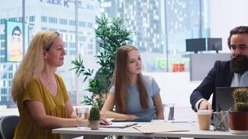Financial advisor presenting financial strategies to customers, recommending stock market bonds. Broker in office assisting clients with forex investment portfolio management, camera A video