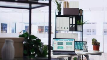 Stock market shares going up and down on laptop in empty financial department office, price volatility concept. Forex trading economic analytics figures on notebook screen in workplace video