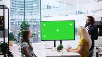 Financial adviser conducting audit of clients income, doing presentation on green screen to help them build saving habits. Agent using large mockup display to show investing tips, camera A video