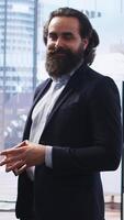 Vertical Portrait of smiling financial advisor sitting in office with parent and child to provide personalized spending planning. Upbeat agent in workspace evaluating clients financial needs, camera A video