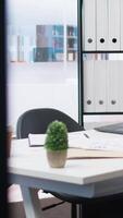 Vertical Empty company financial department with stock portfolio on laptops containing collection of investment assets. Workspace with live index indices on notebook screen showing stock demand surge video