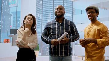 Real estate broker and client analyzing blueprints for an office space, evaluating the property and reaching a contract agreement. Businessman planning an investment strategy. Camera A. photo