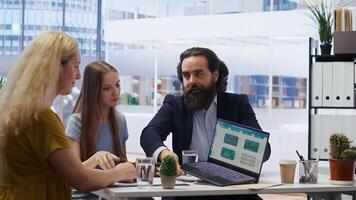 Financial advisor presenting detailed financial market analysis to clients, helping them make informed investment decisions. Broker providing customers with financial analysis, camera B photo