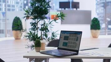 Stock exchange portfolio on laptop containing investment assets affected by market volatility. Empty workplace with live index indices on notebook screen showing stock demand surge photo