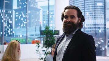 Portrait of happy financial advisor meeting with clients to recommend financial products and investments such as stocks and bonds. Cheerful agent informs family of best investment strategies, camera A photo