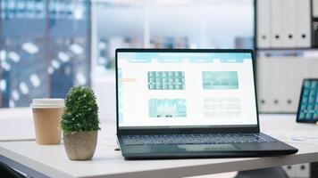 Stock portfolio on laptop containing investment assets affected by market volatility. Empty workplace with live index indices on notebook screen showing stock demand surge, close up photo