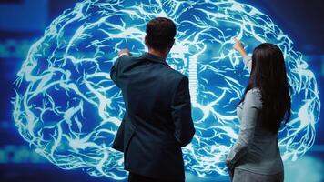 IT staff members using artificial intelligence computing simulating human brain thought processes. Coworkers building AI machine learning algorithms in futuristic workspace, camera B photo